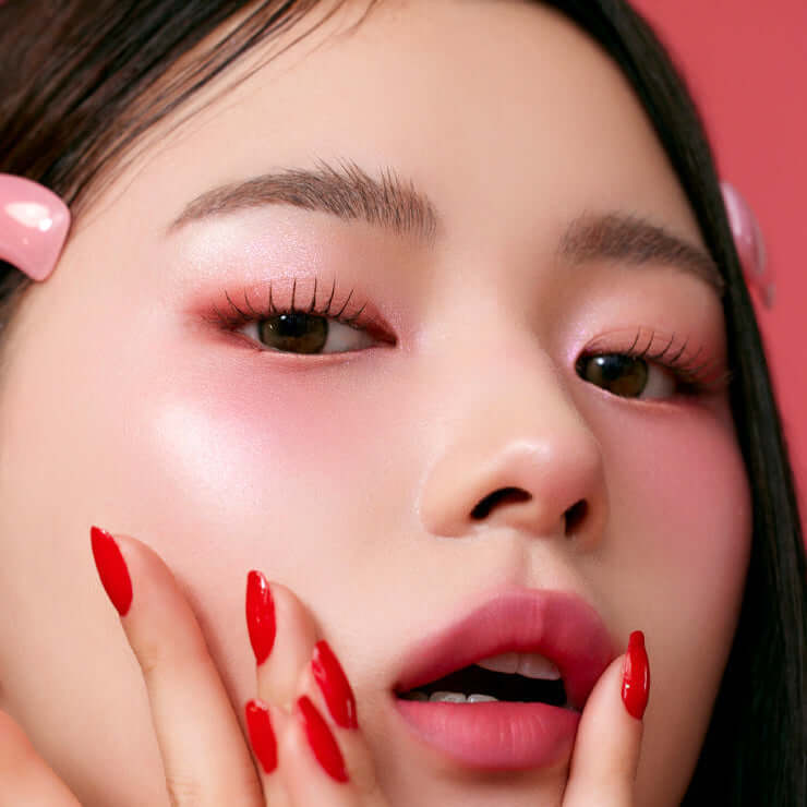 Close-up of vibrant makeup using MUDE Feel Lively Eyeshadow Palette in pink hues on model's eyes and cheeks