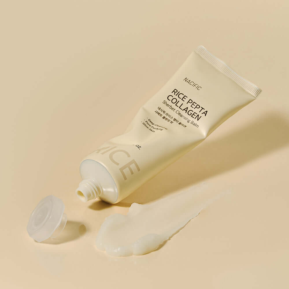 NACIFIC Rice Pepta Collagen Shavette Cleansing Balm 80g tube with spilled balm on beige background