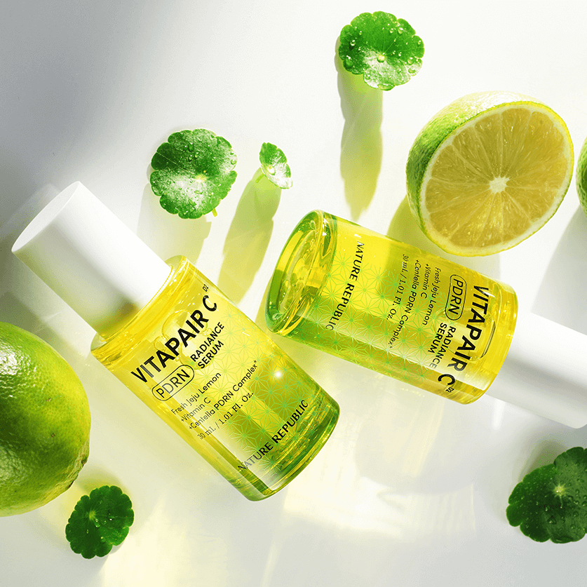 NATURE REPUBLIC Vitapair C PDRN Radiance Serum 30ml bottles with citrus and leaves on white background, highlighting skincare benefits