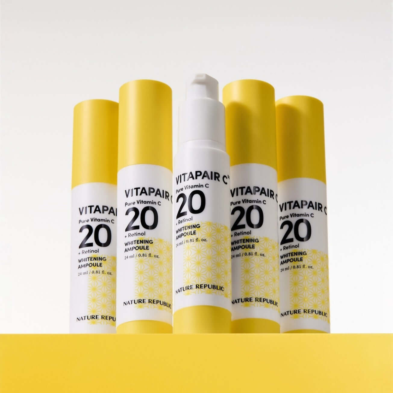 NATURE REPUBLIC Vitapair C Pure Vitamin C 20 Whitening Ampoule 24ml bottles displayed on a yellow background