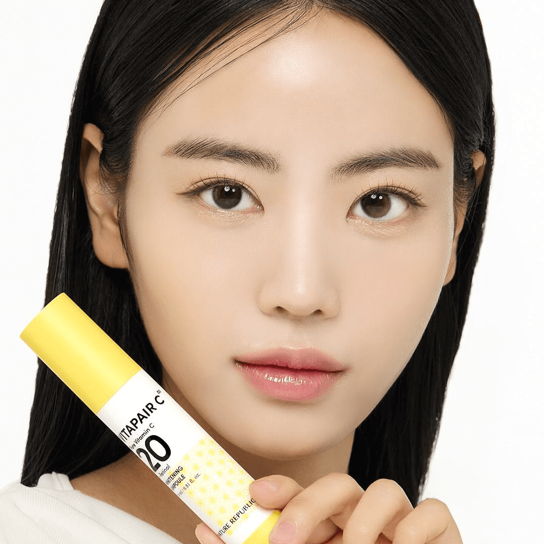 Woman holding NATURE REPUBLIC Vitapair C Pure Vitamin C 20 Whitening Ampoule 24ml product.