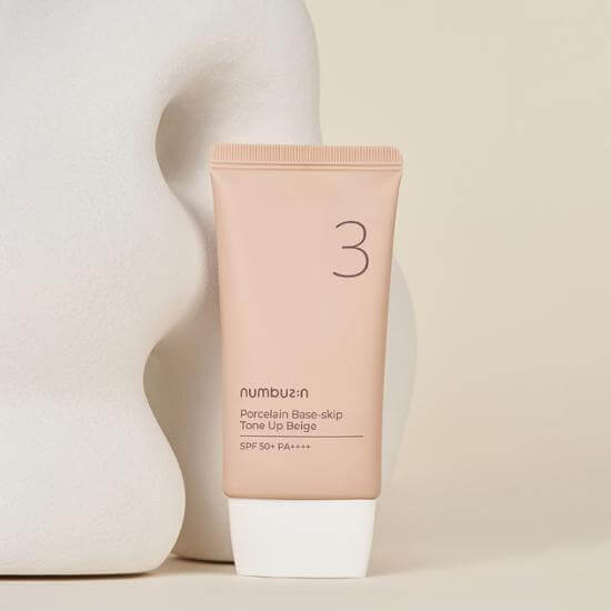 NUMBUZIN No.3 Porcelain Base-Skip Tone Up Beige SPF50+ PA++++ tube against a neutral background.