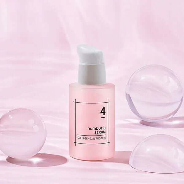 NUMBUZIN No.4 Collagen 73% Pudding Serum bottle on pink background with clear bubbles