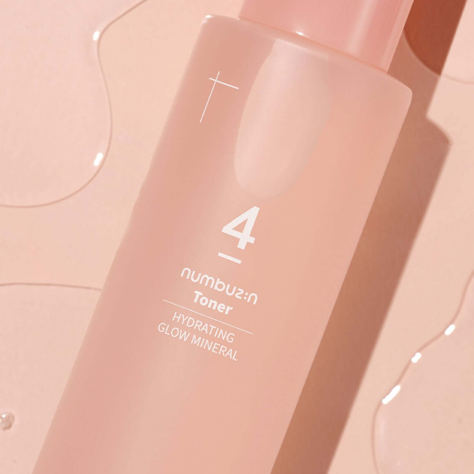NUMBUZIN No.4 Hydration Glow Mineral Toner bottle on pink background