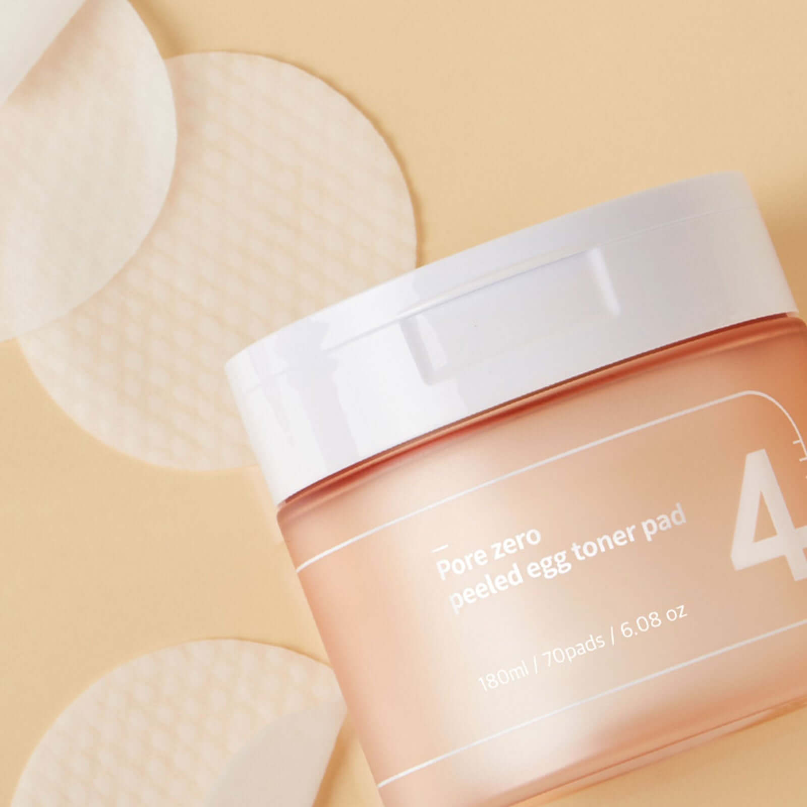 NUMBUZIN No.4 Pore Zero Peeled Egg Toner Pad on display with individual toner pads.