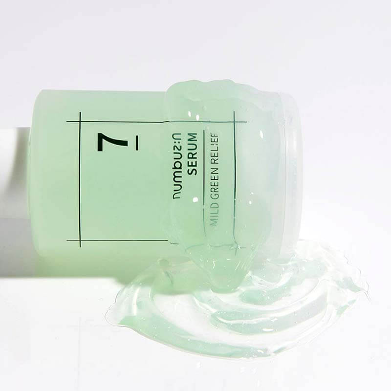NUMBUZIN No.7 Mild Green Soothing Serum bottle spilling on surface