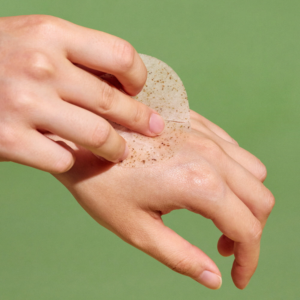 Applying NUTSELINE Cica Nut Calming Pads on hand for soothing skincare