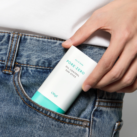 OBGE Pore Zero Oil Control Sun Stick held by a gentleman in jeans pocket — Gentleman Korea men’s oil-control sunscreen stick
