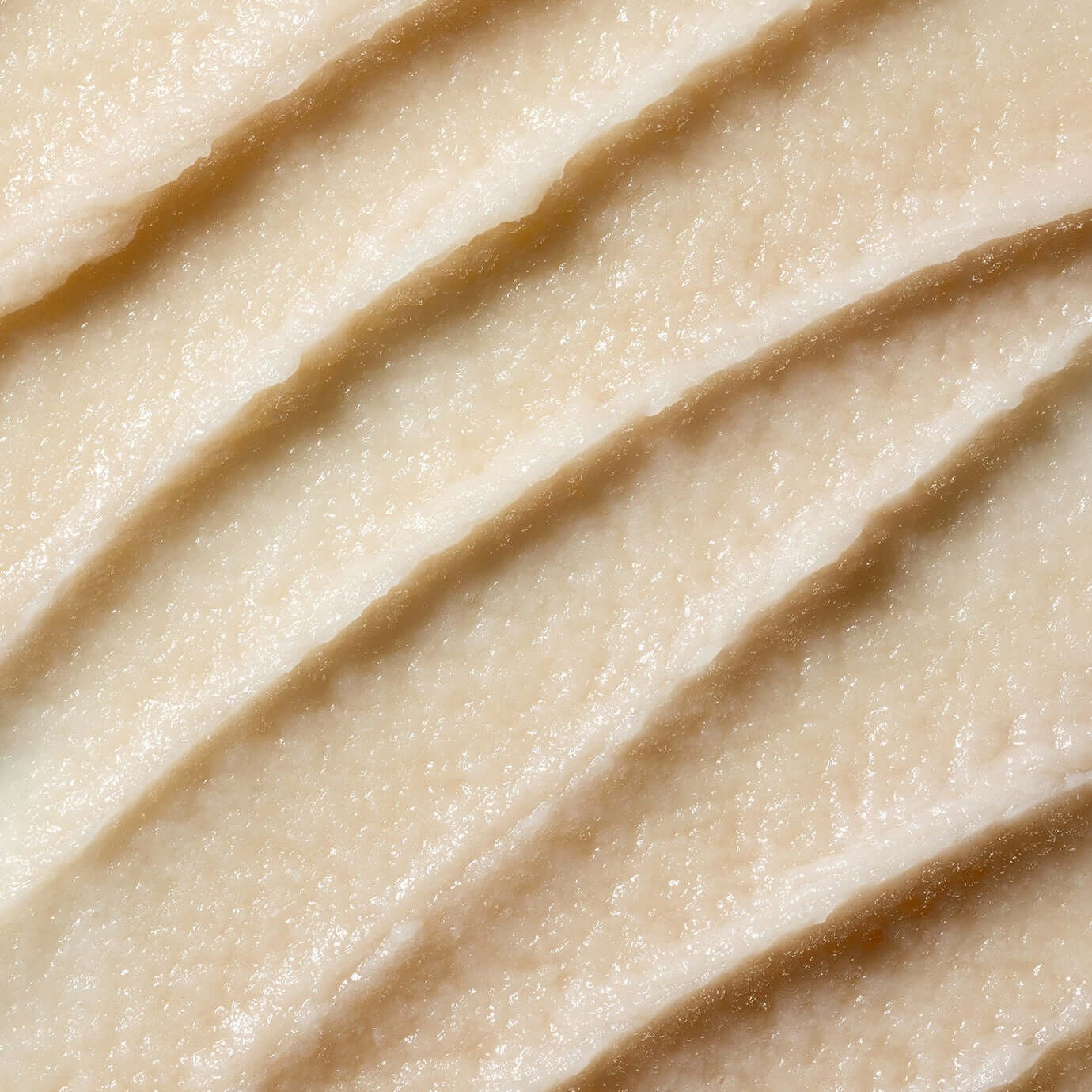 Close-up texture of PARNELL AHA Omija Ceramic Bubble Peeling Cleanser 180ml skincare product.