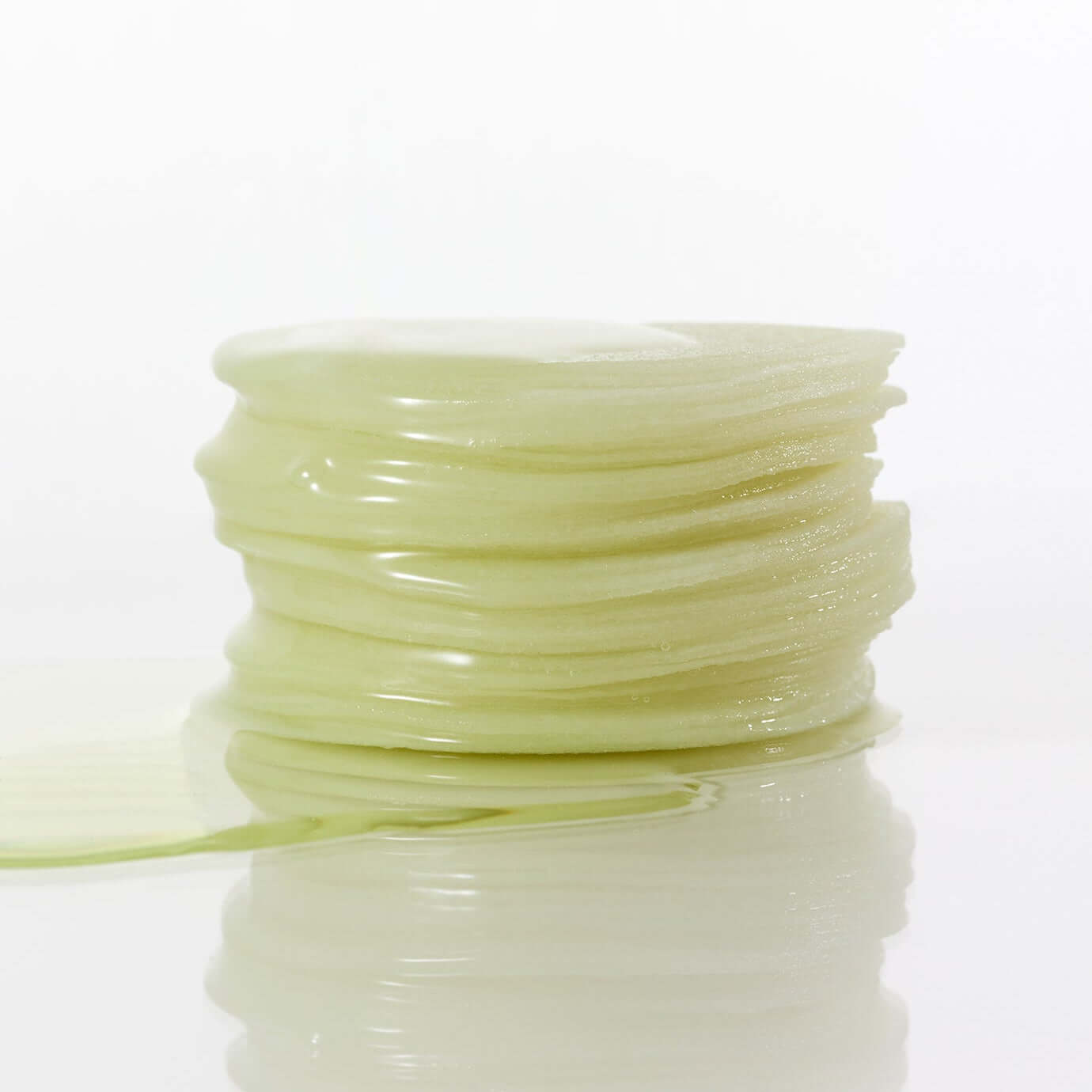 Stack of soothing PARNELL Panthenol Heartleaf Calming Pad 60pads on a reflective surface