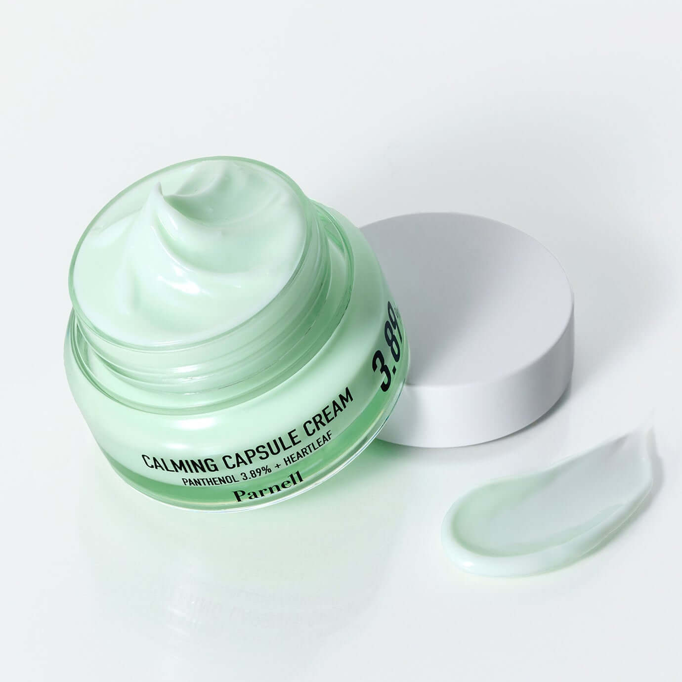 PARNELL Pathenol 3.89 Heartleaf Calming Cream 50ml jar with open lid showing texture and a dollop on the side.