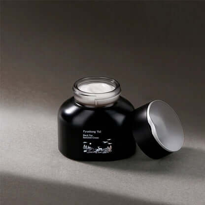 PYUNKANG YUL Black Tea Enriched Cream 60ml in an open jar with a visible cream texture