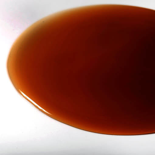 Close-up of PYUNKANG YUL Black Tea Oral Hair Loos Relief Shampoo 500ml liquid texture.