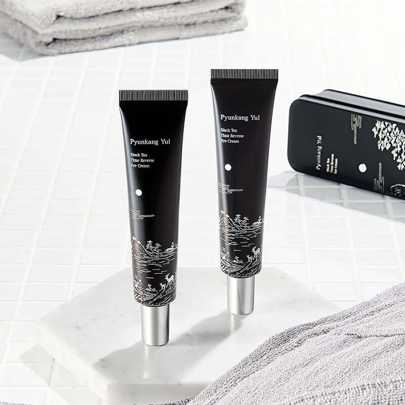 PYUNKANG YUL Black Tea Time Reverse Eye Cream 25ml tubes on white surface for anti-aging skincare