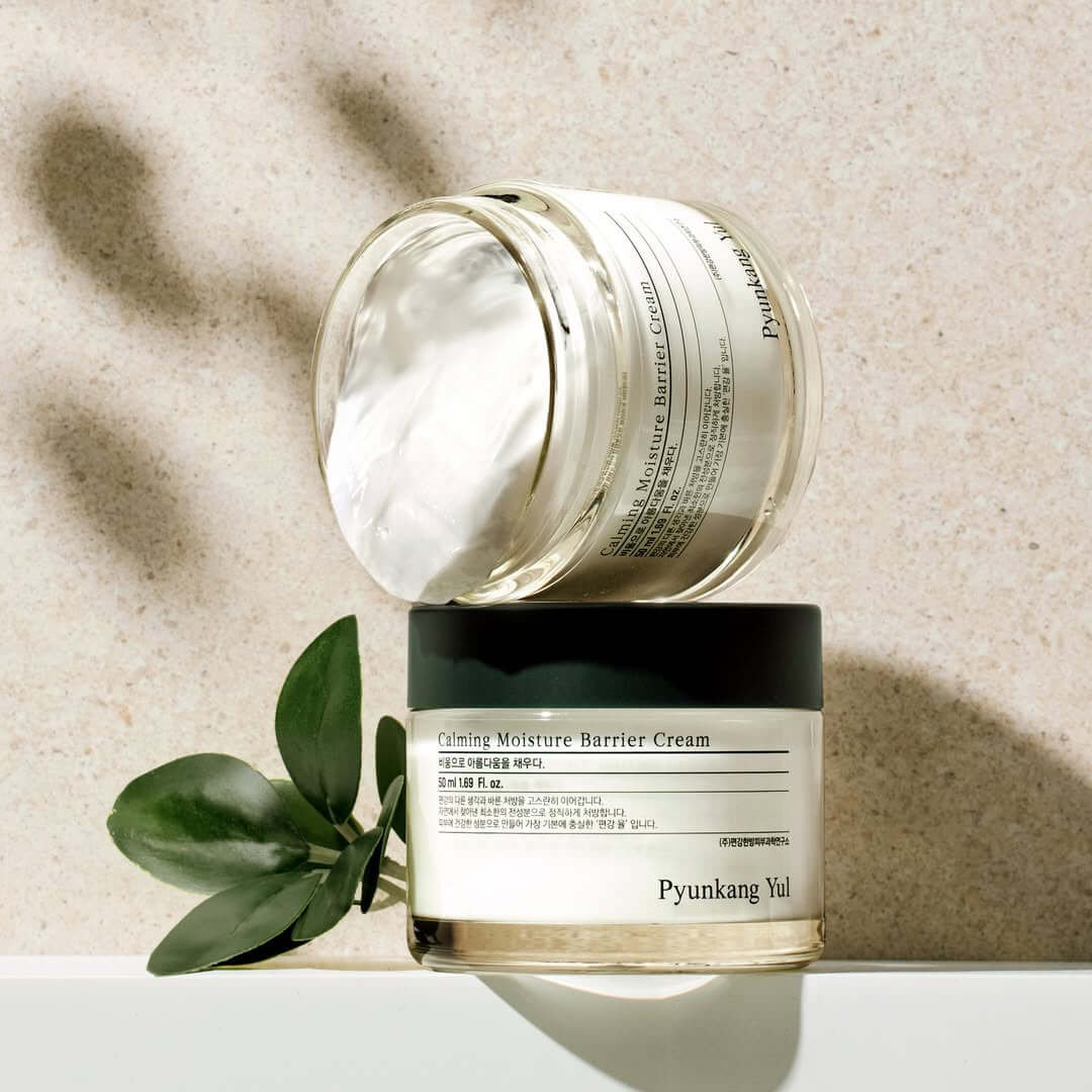 PYUNKANG YUL Calming Moisture Nourishing Cream 50ml jar on display with natural leaves