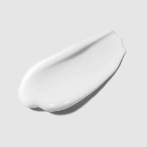 Texture of PYUNKANG YUL Calming Sun Cream SPF+PA++++ 50ml on a gray background