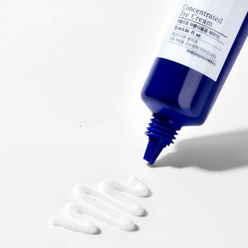 Tube of PYUNKANG YUL Intensive Care Eye Cream 25ml with cream dispensed on a white surface