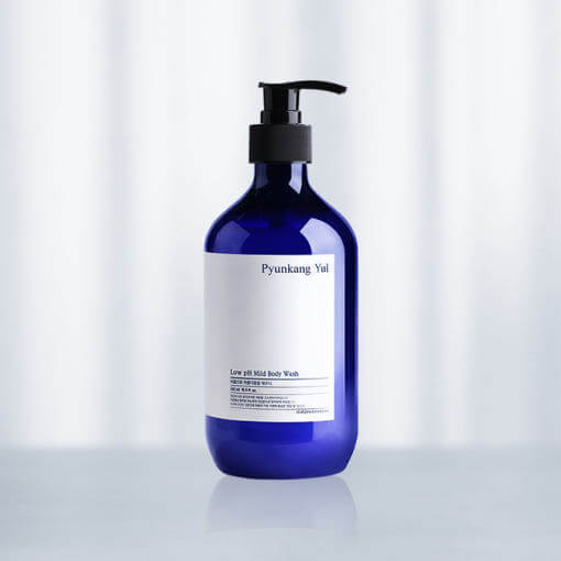 PYUNKANG YUL Low pH Mild Body Wash 500ml product image, featuring a blue bottle with black pump, against a soft background.