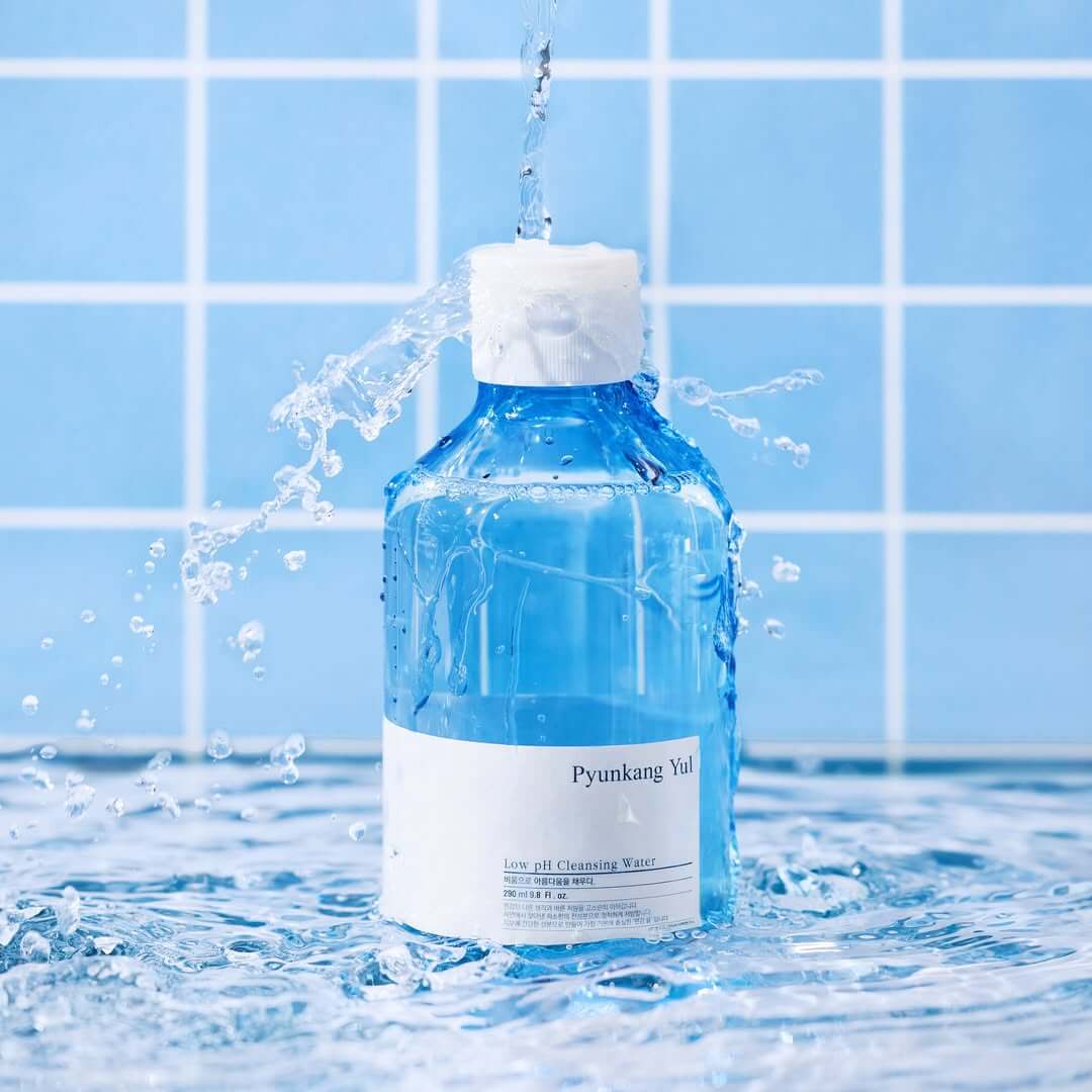 PYUNKANG YUL Mildly Acidic Cleansing Water 290ml bottle with water splash, blue tiled background