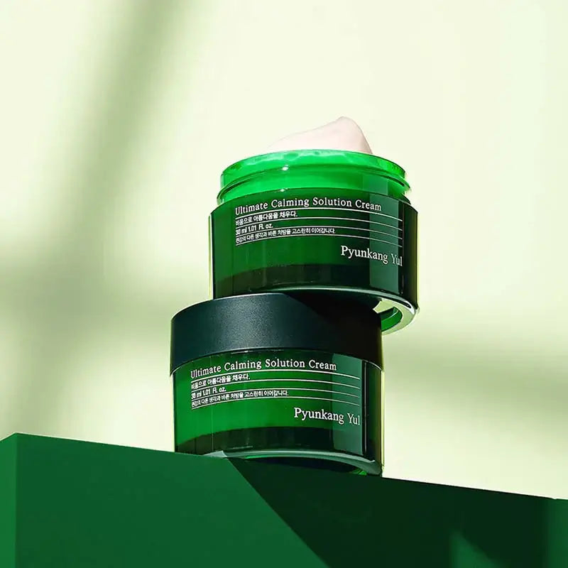 PYUNKANG YUL Ultimate Soothing Solution Cream 30ml jar on display, highlighting green packaging and calming properties.