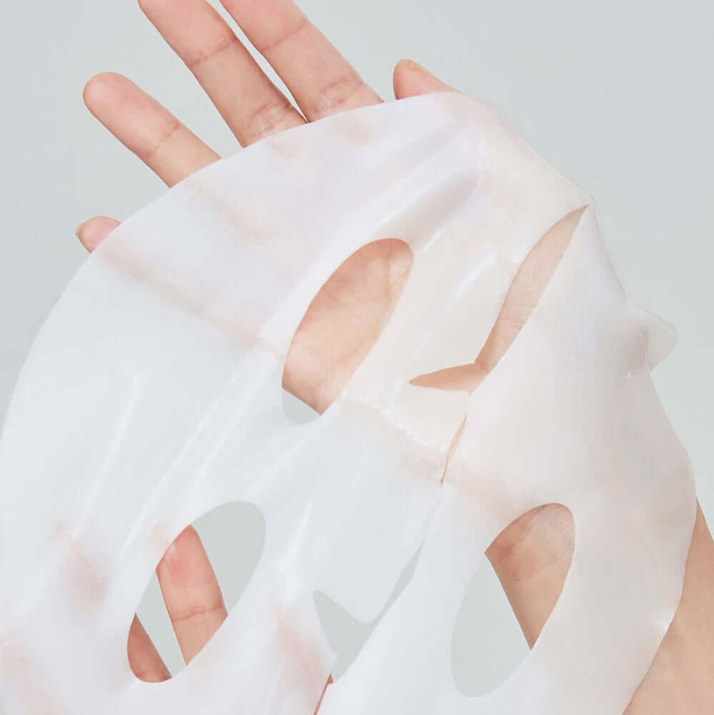 Hand holding REAL BARRIER Retinol Pore Tightening Serum Gel Mask x5 Sheets, showcasing translucent mask texture.