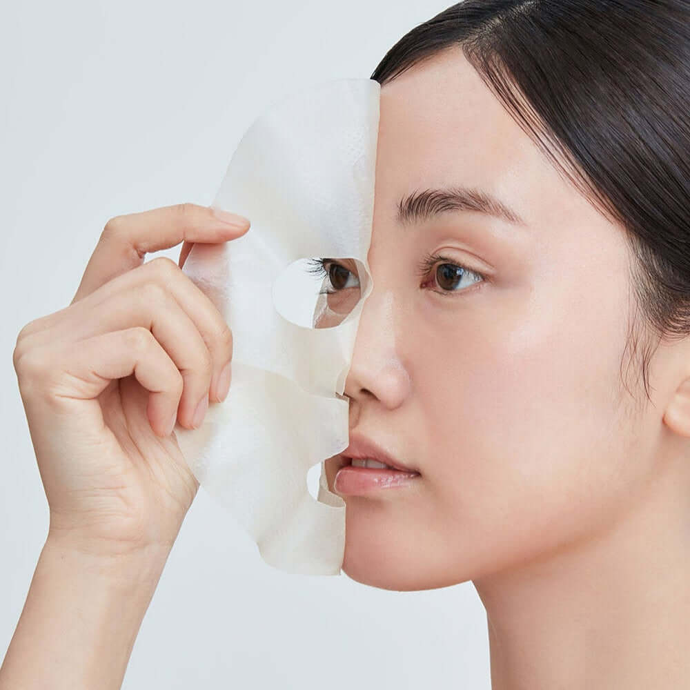 Woman applying REAL BARRIER Retinol Pore Tightening Serum Gel Mask x5 Sheets for skincare routine