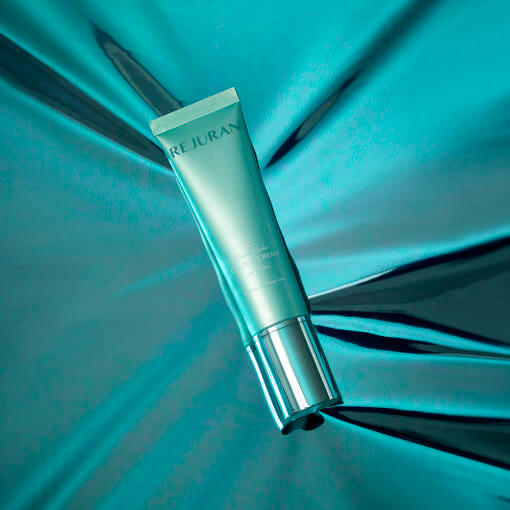 REJURAN Recover Healer Firming Cream 50ml tube on teal background