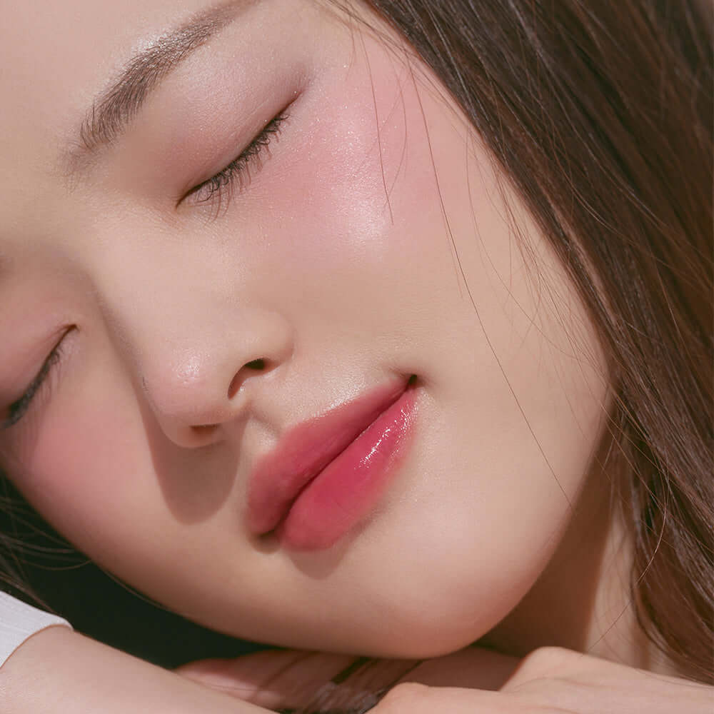 Close-up of a woman wearing ROMAND better than cheek #springfever blush, showing soft, natural makeup look with rosy cheeks.
