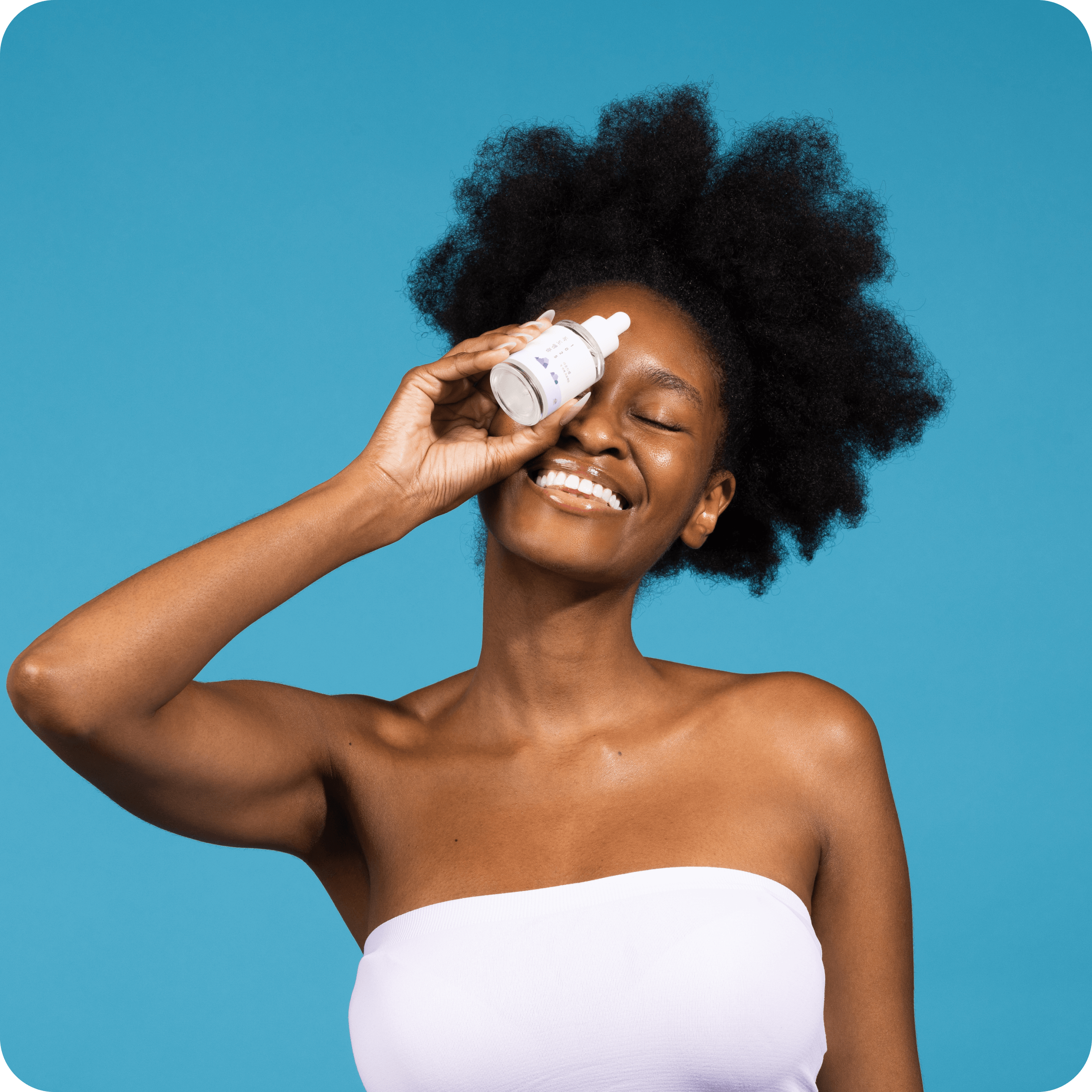 Person holding ROUND LAB 1025 Dokdo Ampoule 45g in front of a blue background, showcasing skincare product