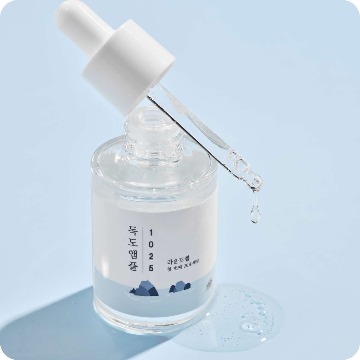 ROUND LAB 1025 Dokdo Ampoule 45g with dropper, emphasizing skincare benefits.