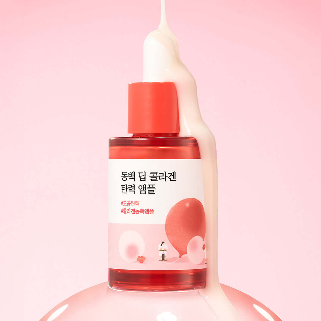 ROUND LAB Dongbeak Deep Collagen Elasticity Ampoule 30ml bottle against pink background with cream dripping from above