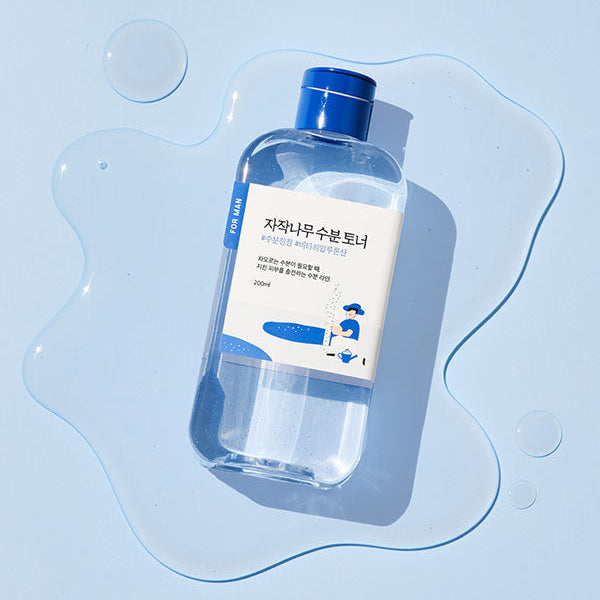 ROUND LAB For Men Birch Moisture Toner 200ml - Gentleman Korea product shot on blue background, clear bottle with blue cap