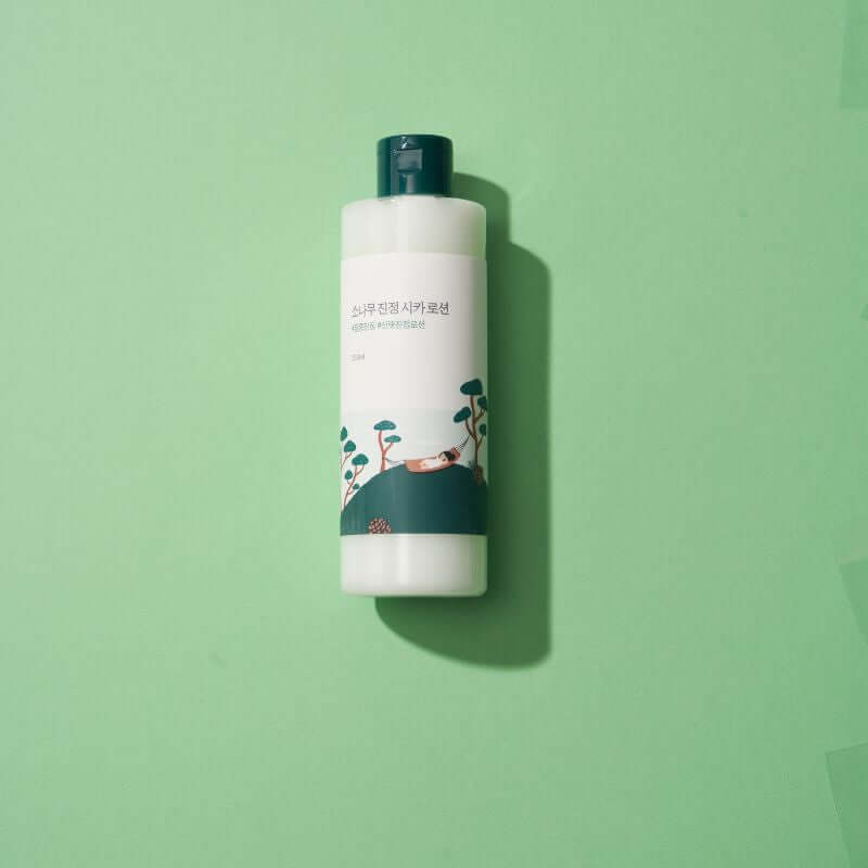 Image of ROUND LAB Pine Calming Cica Lotion 250ml on a green background