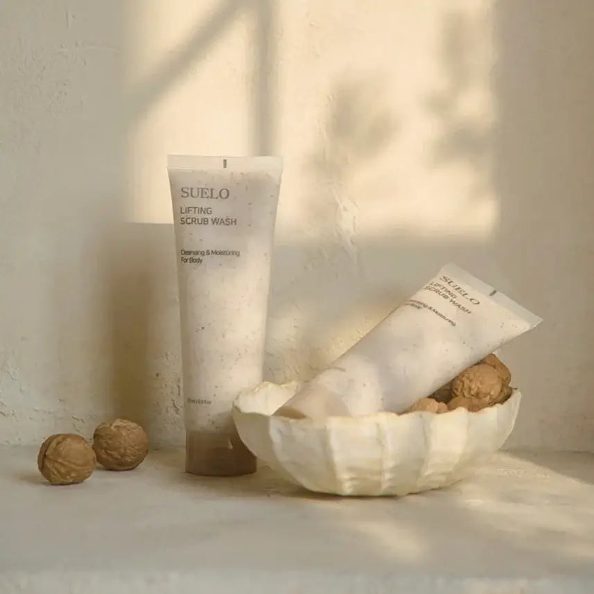 SUELO Lifting Body Scrub Wash in elegant packaging with natural elements, ideal for skin revitalization and moisturizing.