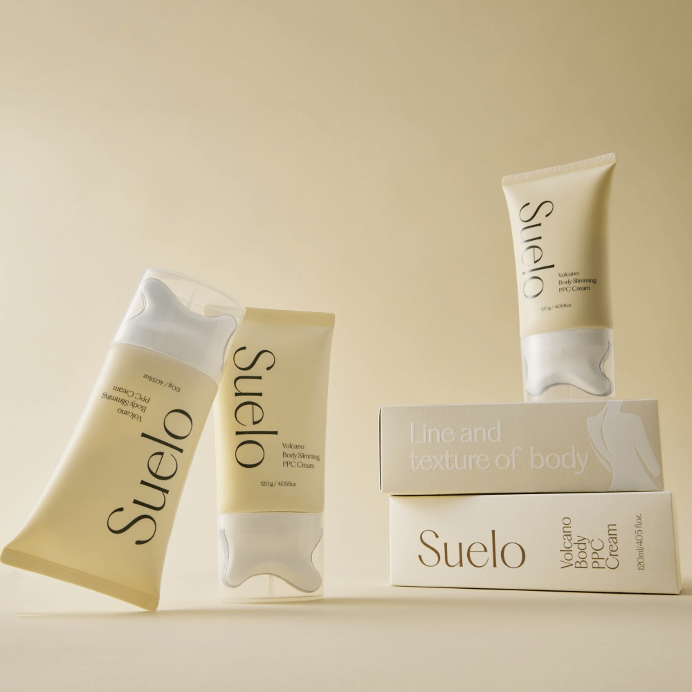 SUELO Volcano Body PPC Cream tubes and boxes on a beige background showcasing the product.