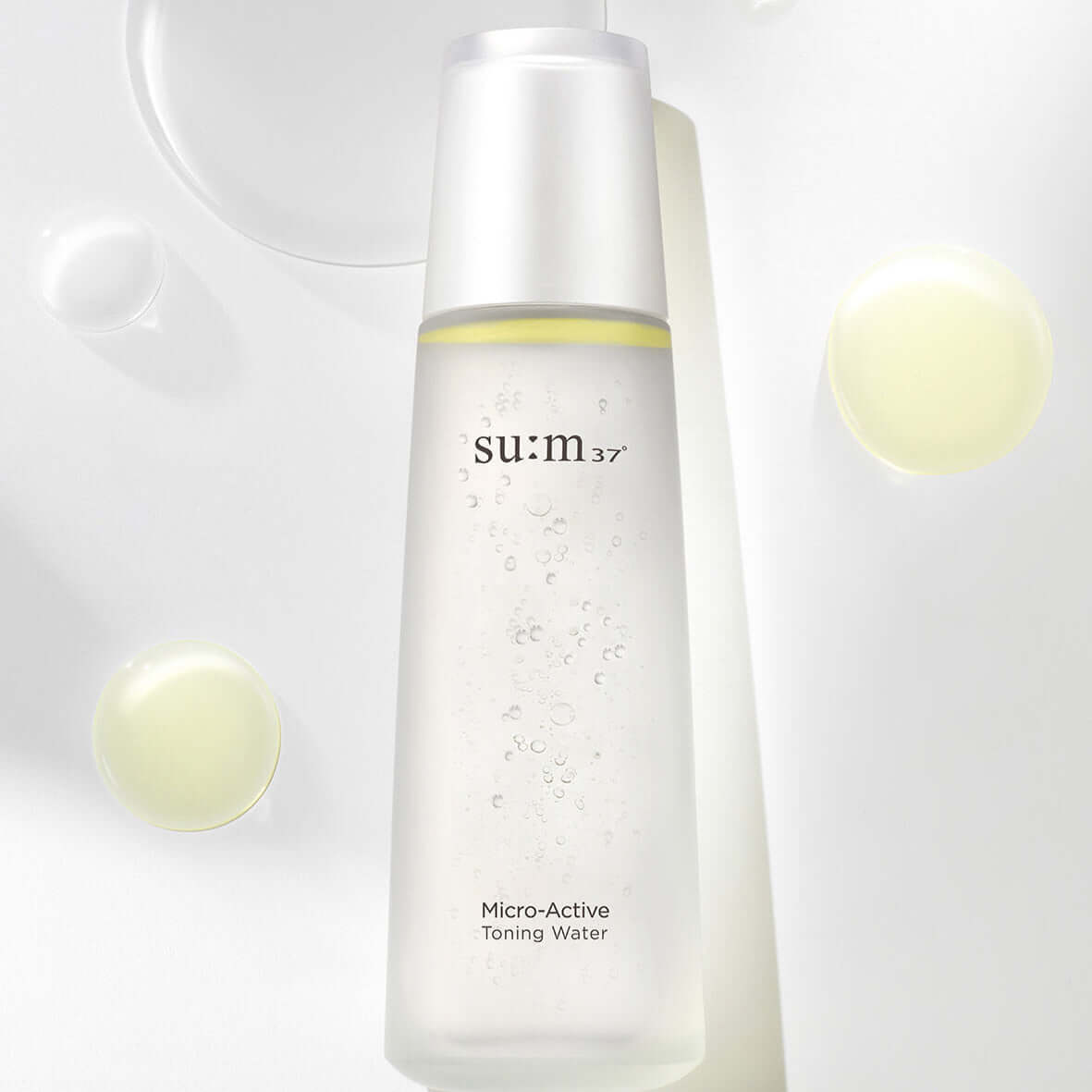SU:M37 Microactive Toning Water 150ml bottle with clear liquid on light background.