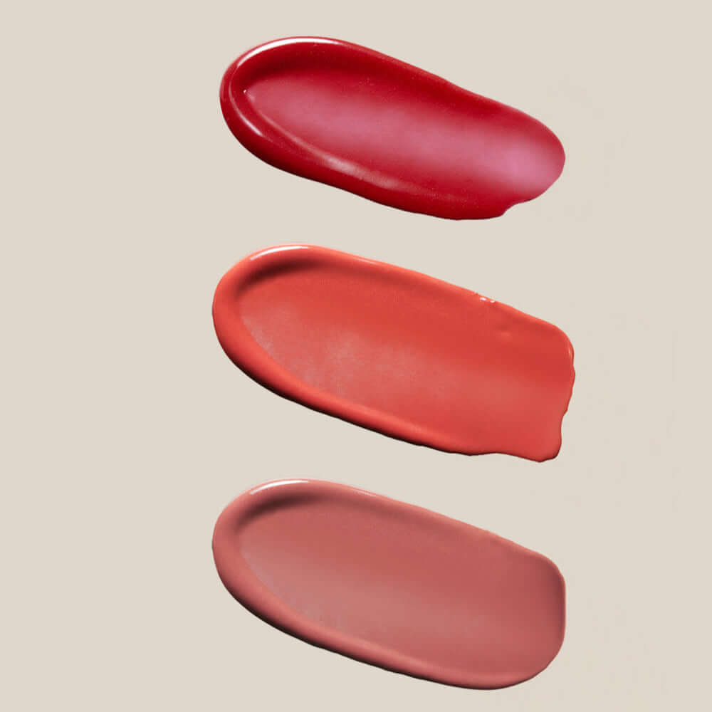 Color swatches of SU:M37 Skin-Stay Glossy Lip Balm in vibrant shades on a neutral background.