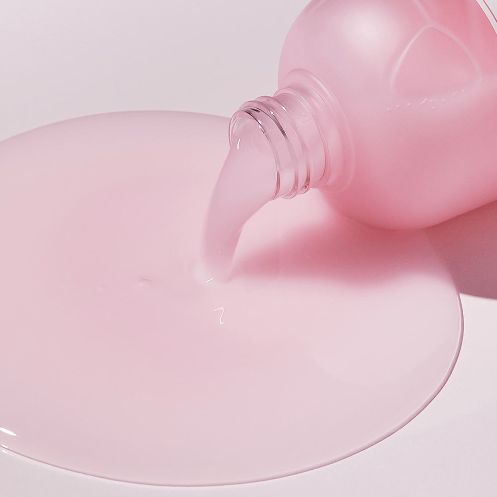 Pouring pink liquid of SUNGBOON EDITOR Apple Peel Glow Skin Soothing Toner 340ml