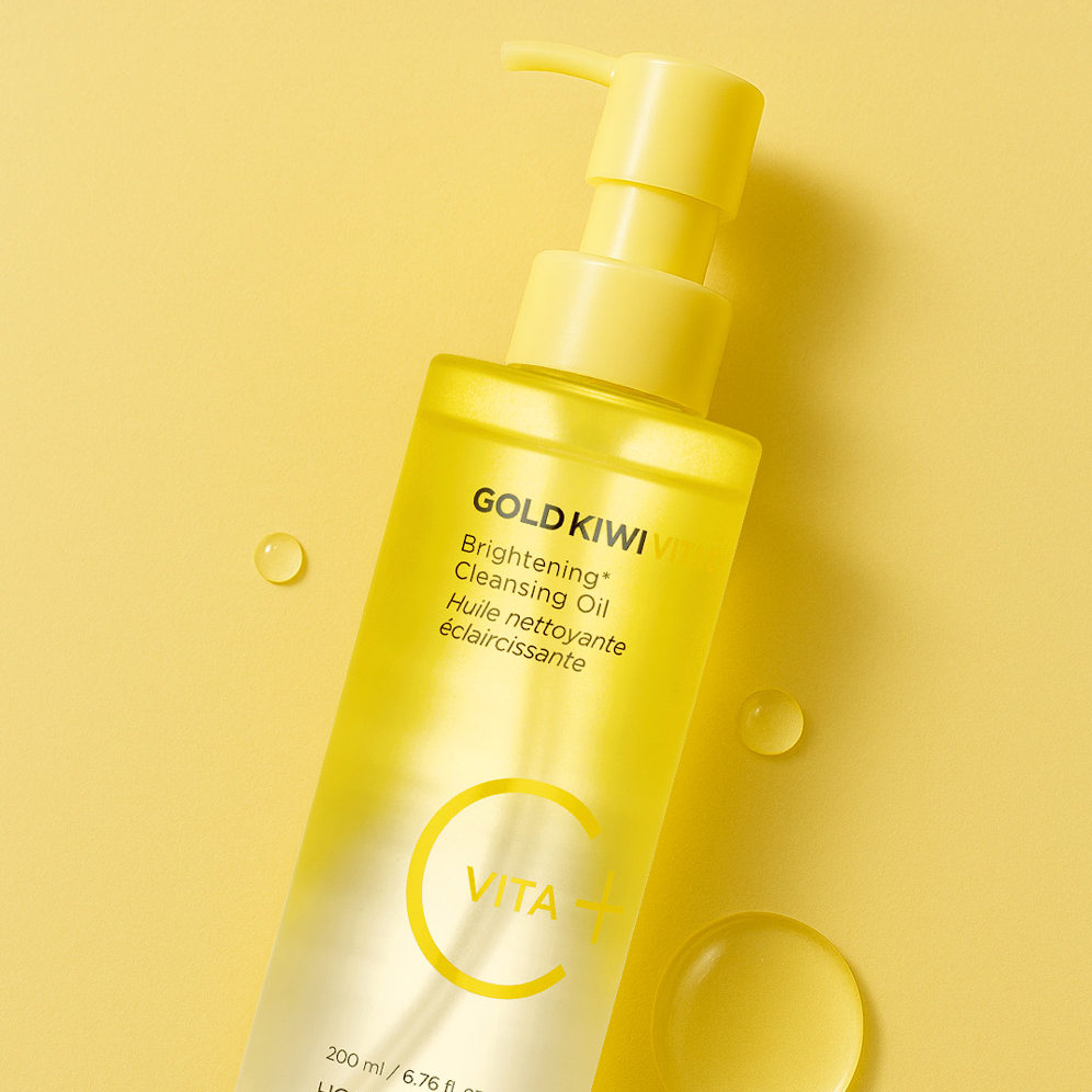 HOLIKA HOLIKA Gold Kiwi Vita C+ Brightening Cleansing Oil 200ml bottle on yellow background.