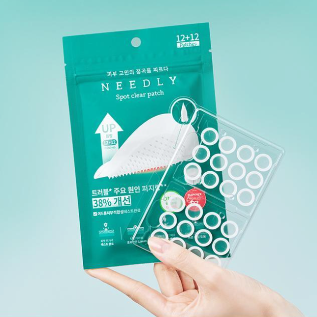 NEEDLY Patch Spot Clear 12 Patches package with clear spot patches held in hand