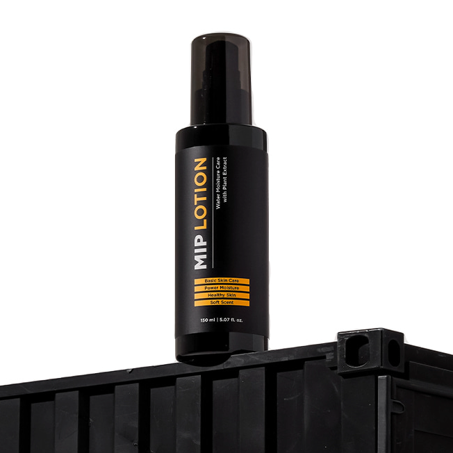 MIP Basic Lotion 150ml black pump bottle on crate, Korean men’s skincare by Gentleman Korea, minimalist product shot