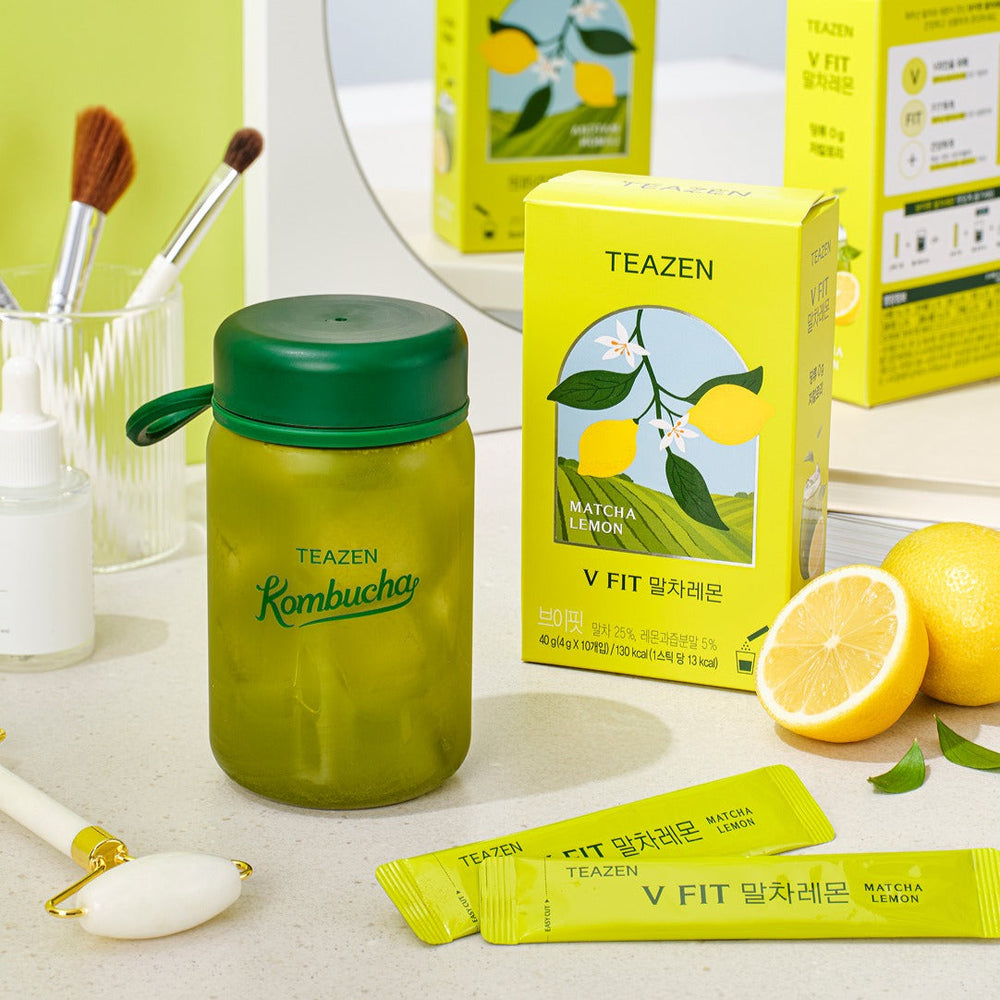 TEAZEN V-Fit Matcha Lemon 10 Sticks product display with refreshing drink, packaging, and lemon slices on a clean countertop.