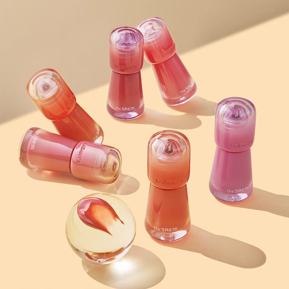 Collection of THE SAEM Saemmy's Aid Shot Tint bottles in various shades displayed on a light surface.