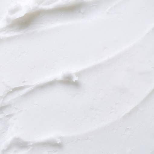 Texture of THE SAEM Soft Blurring Primer Lip Balm, showcasing a smooth and creamy consistency for skin-perfecting application.