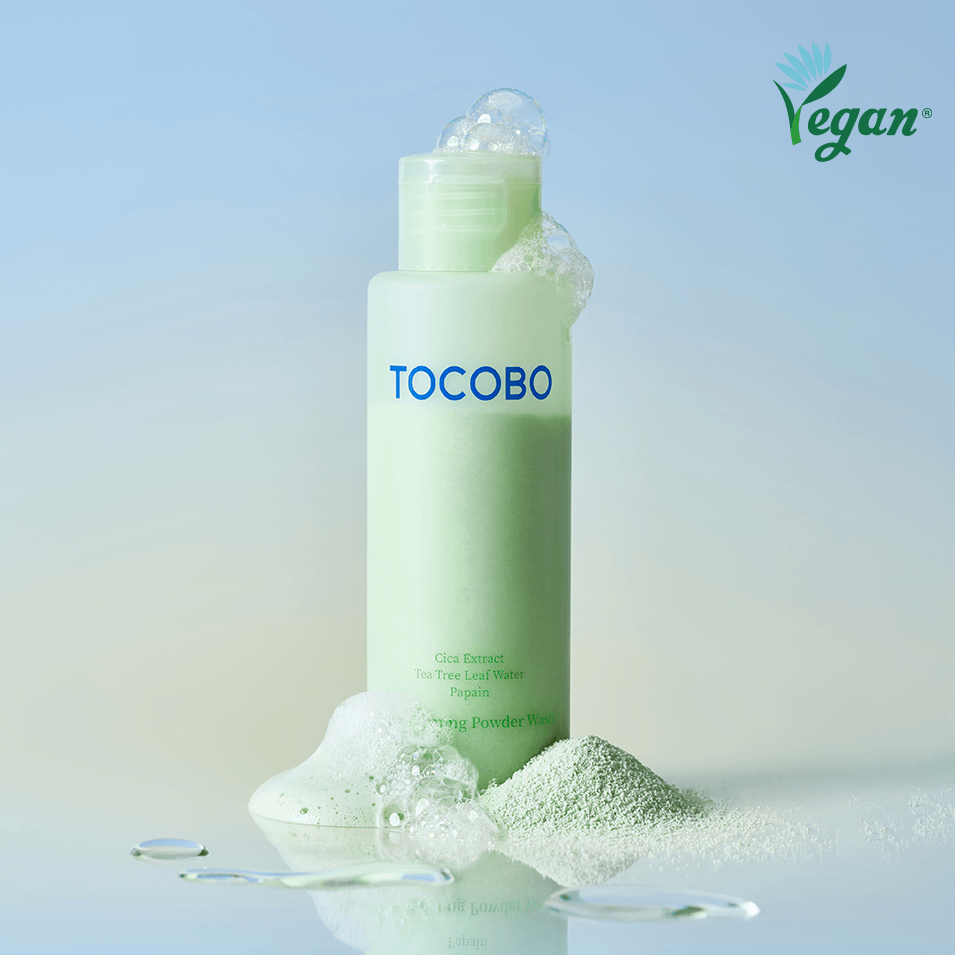 TOCOBO Cica Calming Powder Wash vegan skincare product with green bottle and powder scattered around