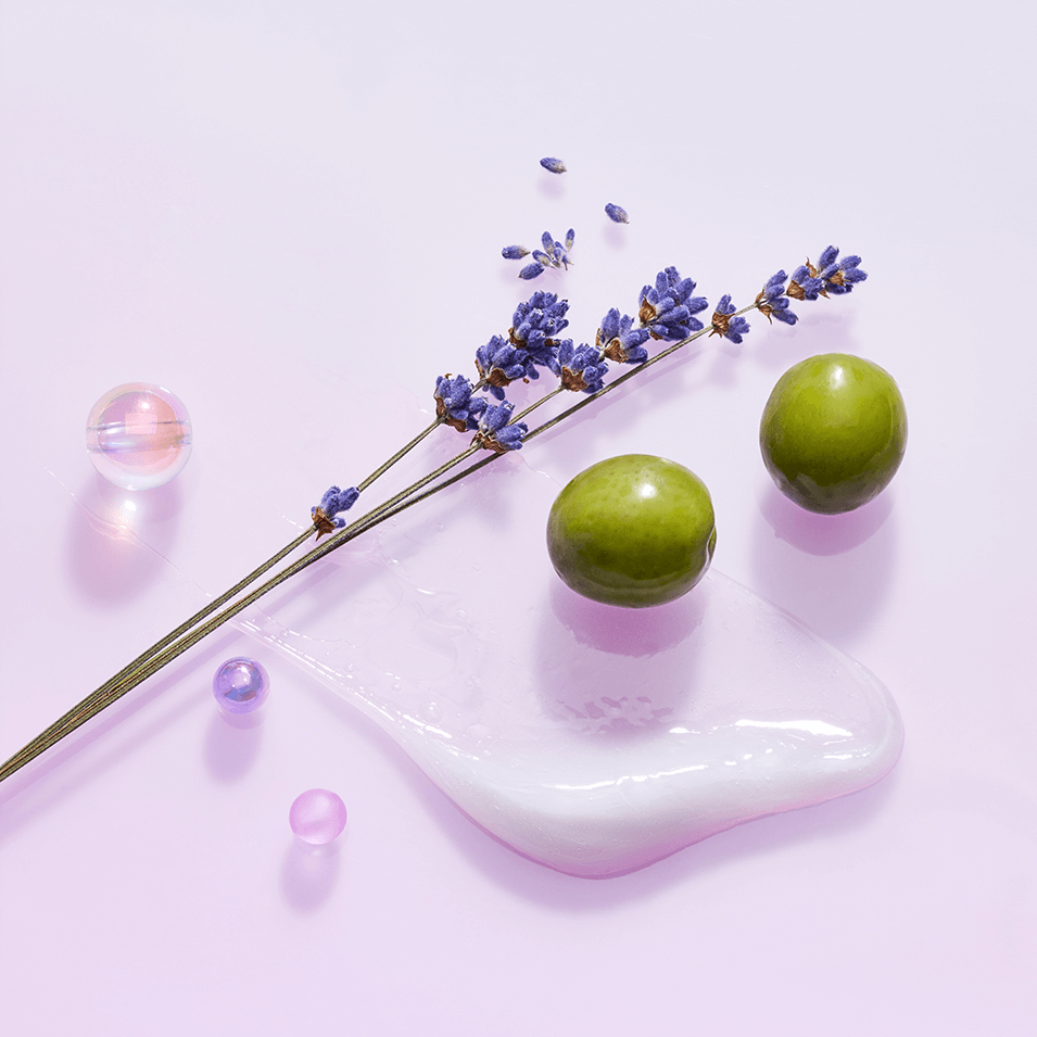 TOCOBO Collagen Boosting Lip Mask ingredients including lavender and natural elements on a pastel background.