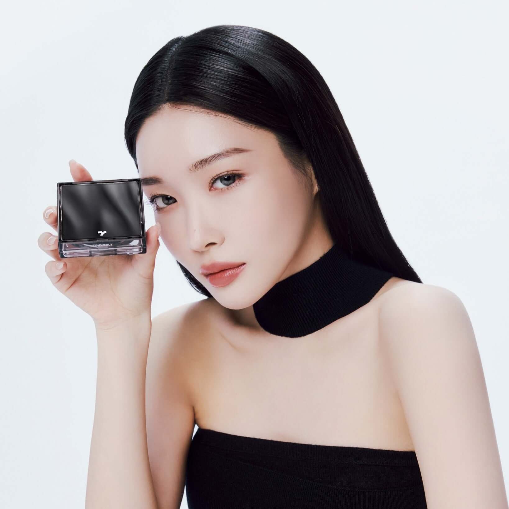 Model showcasing TONY MOLY Skin Tone Fixing Cover Cushion in a stylish beauty shoot.