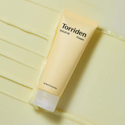 TORRIDEN Solid In 5D Multi Ceramide Cream 70ml tube on creamy background, highlighting skin hydration benefits, 70ml