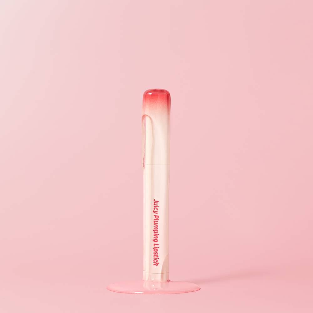 TOUCH IN SOL Vegan Again Juicy Plumping Lipstick on a pink background