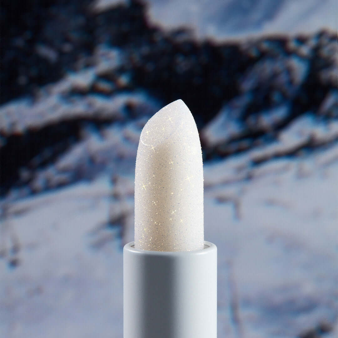 UNLEASHIA Glacier Vegan Lip Balm against snowy background